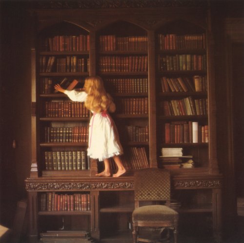 She is trying to grab her favorite book...